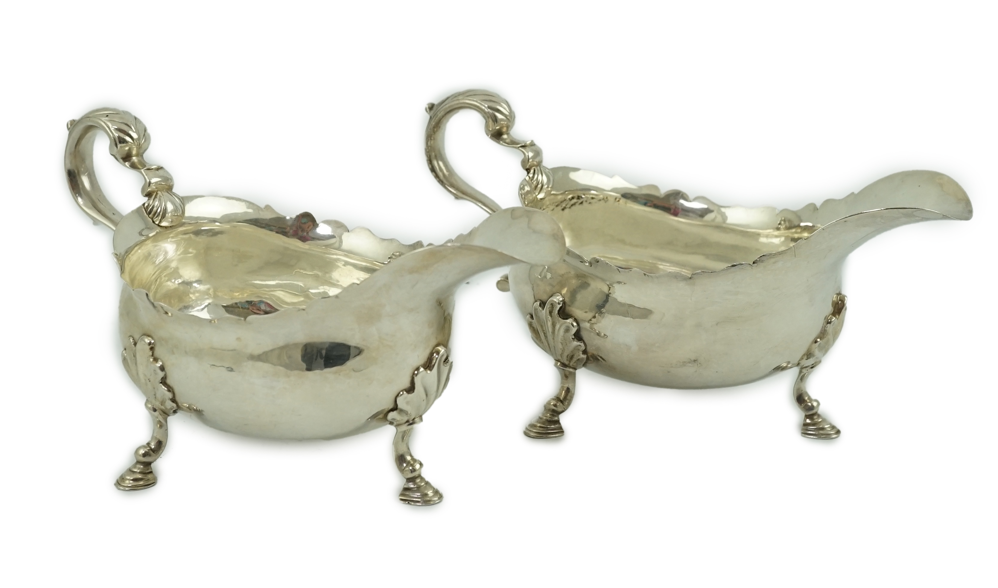 A pair of late George II silver sauceboats by Robert Albin Cox